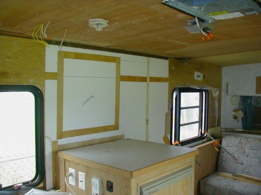 rebuilt wall behind refrigerator.jpg