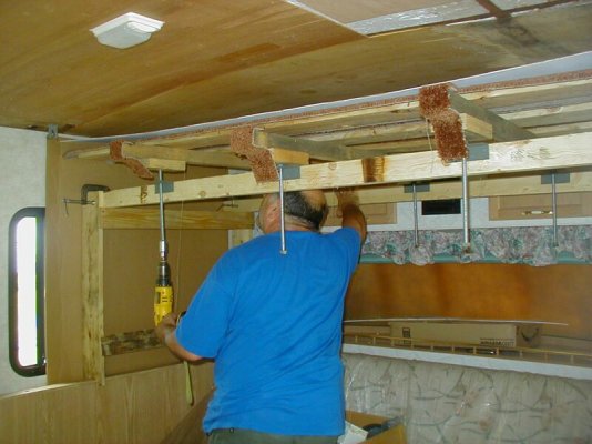 Installing first ceiling panel.jpg