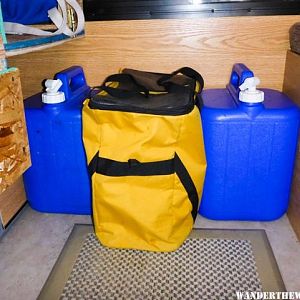 Water jugs and cube.  The 5 gln container fits between the bottom drawer and front wall