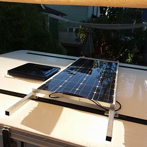 Flexible solar panel mounted to the roof