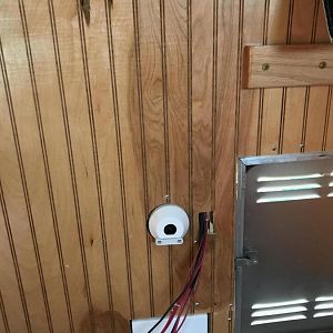 Repositioning wiring, and splicing in paneling to remove hole