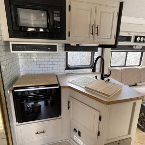 restored kitchen sink in place, new faucet and soap dispensers and cabinet hardware....really taking shape