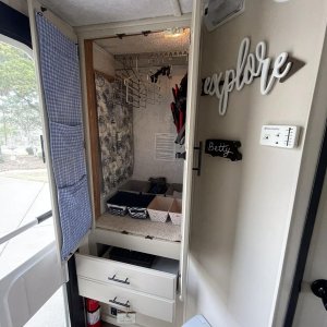 Roomy closet organized with more vertical storage including hanging laundry hamper.
I combined the 2 shallow drawers to make one deep one and we keep 