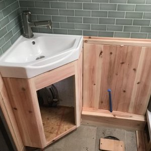 Bath upgrade corner sink and cedar walls