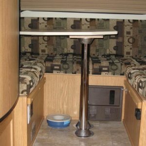 More Room Driver Side with the front dinette table in the rear dinette