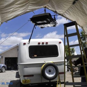 Hoisting up the air conditioner.