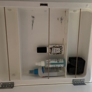 Bungee cords added to medicine cabinet