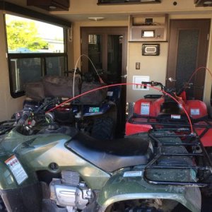 Rancher 420 and two Recon 250s in the garage