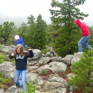 Kids having fun playing on the rocks in the camp ground