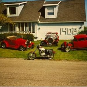 29 Ford Roadster, 32 Chrysler conv/ sedan, 30 Ford Coupe and Triumph motorcycle