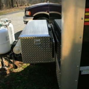 I use the offset in the hinge to hold my sway bars when not in use. Yes, the lid will still open with them laying here.