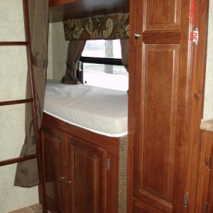 Bottom bunk with storage