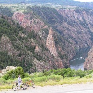 Highway 92 bike ride between Blue Mesa Dam and Pioneer Point Curecanti NRA> Curecanti Needle and Morrow Point Lake with the tour boat cutting wake.