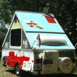 Bubble window painted to resemble a dirigible. Red Baron is flying the tri-wing.