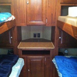 The kids bunk beds that are in the front of the V-Lite with ample storage in the v-nose of the trailer for clothes, books, etc...