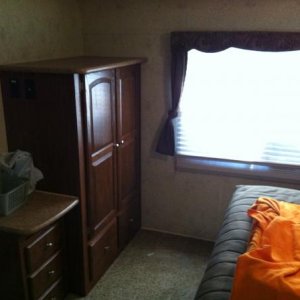 The master bedroom in the rear of the trailer with a slide out and tons of storage.  This is what sold us on this trailer. No traditional trailers had