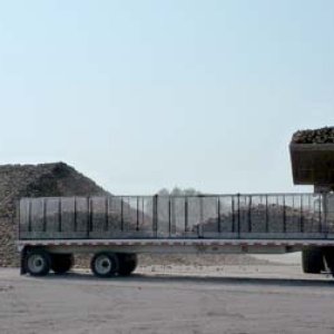 This huge pile of sugar beets, harvested some time ago, is being taken by truck to the processing plant. The pile is something like 30 feet high and 1