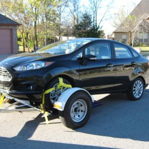 We found out we can FLAT TOW this Ford Fiesta even tho it's a Automatic, just unhook the Neg. cable from battery and put it in Neutral!