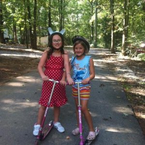 Girls riding scooters