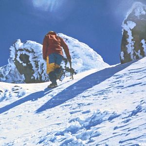 We use crampons and axes to get up the crusty snow near the summit.