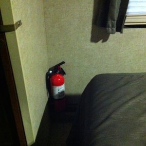 10# fire extinguisher installed in corner of bedroom