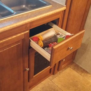 Added a small drawer under the sink. Works great for small stuff.