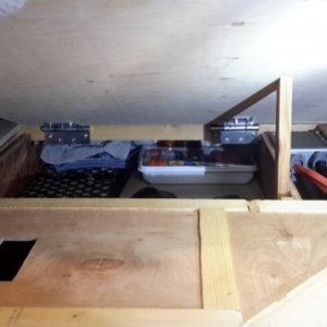 30 x 20 x 6 shoe storage under bed.  Cut out on left reveals water tank level.