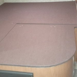 Installled felt covered bed base with storage under queen.