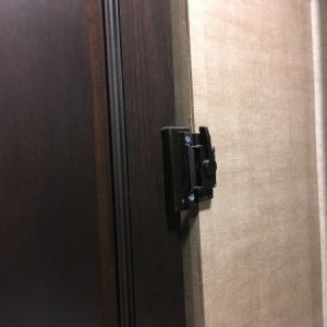 Installed a window latch instead of magnets to hold bedroom door closed while traveling