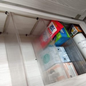 Converted the wardrobe into a pantry space, adding stackable shelves.