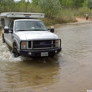 DirtyDog and Diego Fording the Fremont River as Semimike Waits His Turn