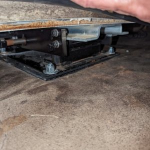 3/8 shim installed under front pad on drivers side slide out due to factory installed with zero clearance at upper forward edge. This caused the seal 