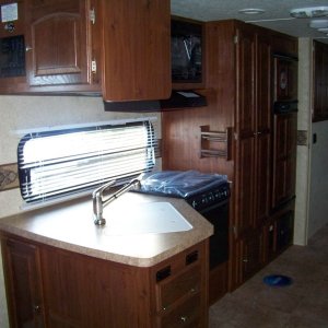 Sink, Pantry, Fridge and Doorway to Bathroom