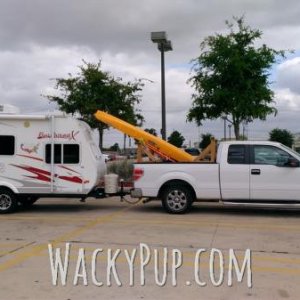 Love my little camper! It is shorter than our truck LOL. This is how we travel with our Hobie tandem kayak. Usually there's a couple bikes thrown in t