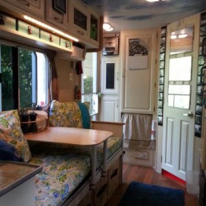 This is the view from the bed to the front door. Behind that little curtain is a real washing machine. On the right is a real dishwasher. Since we are