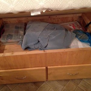 We used 1x10 pine for the drawer fronts and stained them to match.  The drawer pulls are from Lowes and match the rest of the trailer.