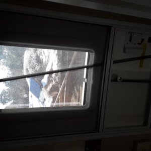 In order to work the new blind with the door closed, and the screen door in the way I added a plastic rod to the blind and it is long enough to reach 