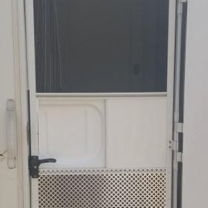 Doggie proofed my screen door, got the thin aluminum  decorative screen from Lowes. cut it to the fit the screen door frame and attached with sheet me