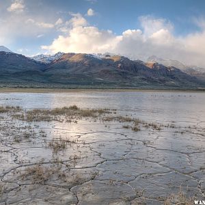 My rig between wet Alvord mud and snowy/cloudy Steens Mt.