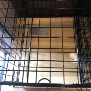 Crates secured to cabinets