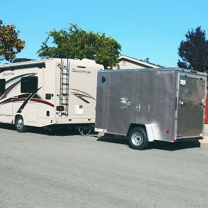 Brownie with new trailer on our street.