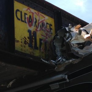 CLEARANCE SIGN RUSTED AND COVERED OVER WITH GRAFFITI