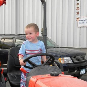 They're never to young to love a tractor; he cried when I took him down; I cried when my wife said I couldn't buy another one.