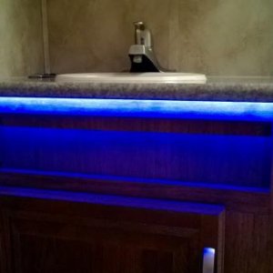 Led under counter top night light in bathroom.