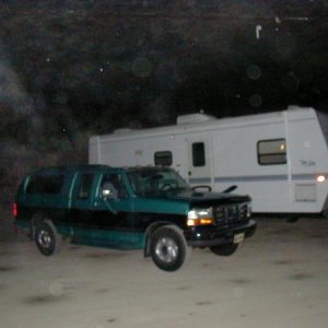 The Eagle 266 FBS parked in an underground limestone mine for the winter with the 96 Ford F-250 parked next to it.  The marker lights are not on, it's