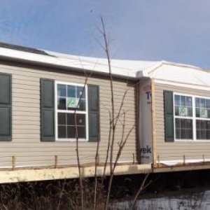 Front section of house as it sits on builder's lot waiting until the basement is completed so it can be set.