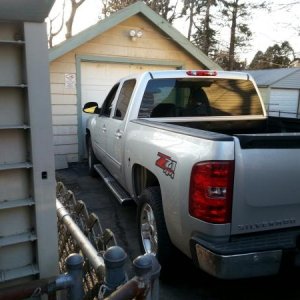 Barely fits in drive, no way she's getting in garage.