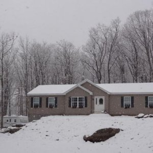 The home base enduring it's first snow on November 26, 2014.  The Jayco Eagle 266 FBS, a veteran to many winter snows, is seen on the left side of the