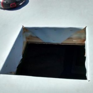 Cut hole in roof and folded EPDM material into hole.