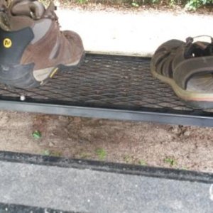 shoe rack keeps dirty shoes outside but off the ground